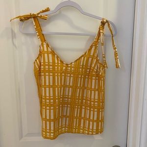 Mustard print tank from Target. Can tie straps either way. Straps non-adjustable